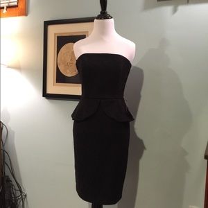 WHBM Black strapless peplum dress.